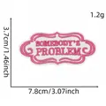 Pink embroidered patch with 'Somebody's Problem' text, size 7.8cm x 3.7cm, weight 1.2g - Pink White "SOMEBODY'S PROBLEM" Style (9#)