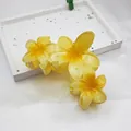 Elegant yellow frangipani flower hair claw clip featuring gradient petals and a firm grip - 11cm Triple Plumeria Style / Black