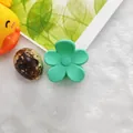 Mint green flower-shaped hair claw clip on white fuzzy background - 4cm Small Flower Style / Matte Green