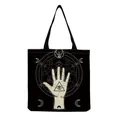 Detailed view of black canvas tote bag featuring occult hand and eye pattern print - Occult All-seeing Eye (hm2705)