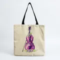 Close-up of a canvas tote bag featuring a purple violin and floral illustration - Purple Violin Floral Style (hm7328)