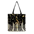 Detailed close-up showing the artistic musical note and piano key print on canvas tote bag - Golden Notes Piano Keys Black Style (hm7335)