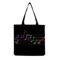 Close-up detail of vibrant neon musical notes printed on black canvas tote bag - Neon Music Notes Square Black Style (hm7336)
