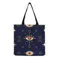 Close-up of a navy blue tote bag featuring detailed mystical evil eye and occult patterns - Deep Blue Mystic Eye (hm2720)