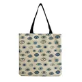 Detailed shot of a stylish canvas tote bag featuring an intricate blue evil eye pattern - Blue Eye Cycle Pattern (hm2722)