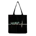 Close-up of Harajuku style music print on a black foldable canvas shopping bag - MUSIC Glitch Art Black Style (hm7352)