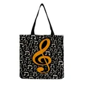 Stylish black tote bag featuring a large golden treble clef and white music symbols - Golden Large Treble Clef Black Style (hm7361)