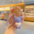 Handmade purple knitted bear keychain with pink heart and braided strap for bag decoration - Heart Hug Bear / Purple