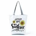White canvas tote bag featuring sunflower print and You are my sunshine design - Sunflower Inspirational Slogan (hl5279)