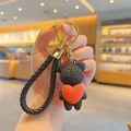 Stylish black knitted bear keychain featuring a red heart and braided rope strap - Heart Hug Bear / Black