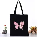 Borsa tote in tela nera caratterizzata da grafica di farfalla rosa e rose. - Stile farfalla rosa e rosa (L4228-2) / Nero