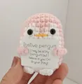 Handmade pink crochet penguin holding a positive message card encouragement gift - Penguin / Pink