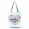 Detailed view of floral heart pattern and Happy Mother's Day print on white tote bag - Floral Heart Holiday Design (hl5288)
