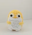 Handmade yellow crochet penguin holding an encouraging positive message card - Penguin / Yellow