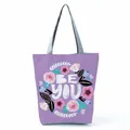 Detail showing a purple tote bag featuring a floral wreath and 'Be You' printed text design - Purple Art Floral Letter (hl5291)