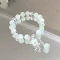 Sweet forest style light green and white crystal beaded bracelet with a moon charm. - Meteor Shower Green