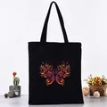 Durable black canvas tote bag featuring a vibrant swirling butterfly graphic print. - Colorful Scroll Butterfly Style (L4228-7) / Black