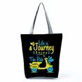 Detailed view of black tote bag with vibrant Life is a Journey scooter graphic print - Black Scooter Journey Style (hl5303)