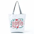 Close-up of cute 'LOVE' letter and floral heart print on a white canvas tote bag - Pink LOVE Letter Floral (hl5304)