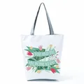 Detailed view of floral patterns and romantic text print on a white canvas tote bag - Floral Ribbon Quote (hl5305)