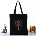 Elegant black canvas tote bag featuring a vibrant colorful butterfly tree print design - Colorful Butterfly Tree Style (L4228-11) / Black