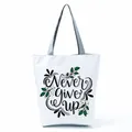 White canvas tote bag featuring decorative 'Never Give Up' letter print and leaves - Inspirational Slogan Leaf (hl5312)