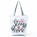 White tote bag featuring 'Stay at home' lettering and cute cartoon plant illustrations - House Sun Succulent (hl5314)