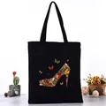 Black canvas tote bag featuring a unique artistic butterfly high-heel shoe print design - Butterfly High Heels Style (L4228-13) / Black