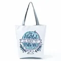 White canvas tote bag featuring a blue globe print and motivational quote detail. - Blue Globe Inspirational (hl5315)