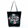Stylish black canvas tote bag featuring floral patterns and Girl Power slogan print - Black Girl Power Floral (hl5316)