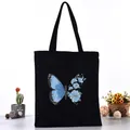 Black canvas tote bag with artistic blue butterfly and flower print, student handbag - Blue Butterfly Floral Style (L4228-14) / Black