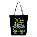 Close-up detail of the black canvas tote bag with 'New Adventure' camper van print. - Black Camper Adventure (hl5317)