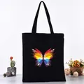 Black canvas tote bag with a vibrant rainbow butterfly print - Colorful Gradient Butterfly Style (L4228-16) / Black