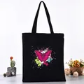 Black canvas tote bag with pink butterfly print and artistic paint splash design - Pink Butterfly Art Spray Style (L4228-18) / Black