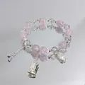 Sweet pink and clear crystal beaded bracelet with silver charms on mirror surface. - Ruyi Bamboo Pink