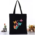 Black canvas tote bag with vibrant butterfly and nail polish print illustration - Butterfly and Nail Polish Bottle Style (L4228-25) / Black