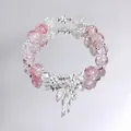 Elegant sweet pink crackle crystal beaded bracelet featuring a silver bow charm on mirror - Peach Blossom Bow Red