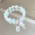 Elegant light blue crystal beaded bracelet with a shimmering star charm on mirror - Meteor Shower Blue