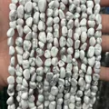 Detailed macro view of natural white howlite irregular stones for jewelry making - 6-8mm (38cm Strand) / Imported White Turquoise