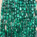 Close-up of natural green malachite irregular stone beads for DIY jewelry making - 6-8mm (38cm Strand) / Natural Malachite
