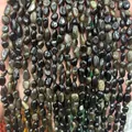 Close-up of polished irregular black natural stones for DIY jewelry making and bead craft projects - 6-8mm (38cm Strand) / Gold Obsidian
