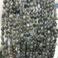 Close-up macro view of 6-8mm natural labradorite stone irregular chips with blue flashes - 6-8mm (38cm Strand) / Labradorite