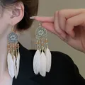 Exquisite bohemian long tassel earrings with white feathers and ethnic medallions. - White Feather Tassel Style (10#)