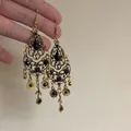 Detailed view of vintage gold teardrop earrings with black faceted crystals and tassels - Black Crystal Carved Tassel Style (21#)