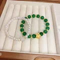 Elegante conjunto de pulseras de perlas blancas y cuentas verdes con flor dorada - Pulsera 39# (Juego de 2 Piezas) / Verde