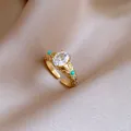 Close-up of 14k gold-plated ring with oval zircon and turquoise beads on silk background - Gold Sunflower Turquoise (5#)