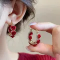 Detail view showing exquisite red flocked rose hoop earrings with sparkling crystal accents - Rhinestone Flower Ear Clip Style (13#) / Red