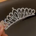 Close-up detail of an elegant silver bridal tiara hair comb with sparkling rhinestones - Ornate Hair Comb Style / Silver