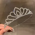Detailed macro view of a sparkling crystal bridal tiara for weddings and birthday parties - Hollow Wave Style / Silver