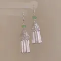 Close-up detail of vintage ethnic tassel earrings with green crystal beads and silver hooks - Flat Bead Metal Long Tassel Style (59#)